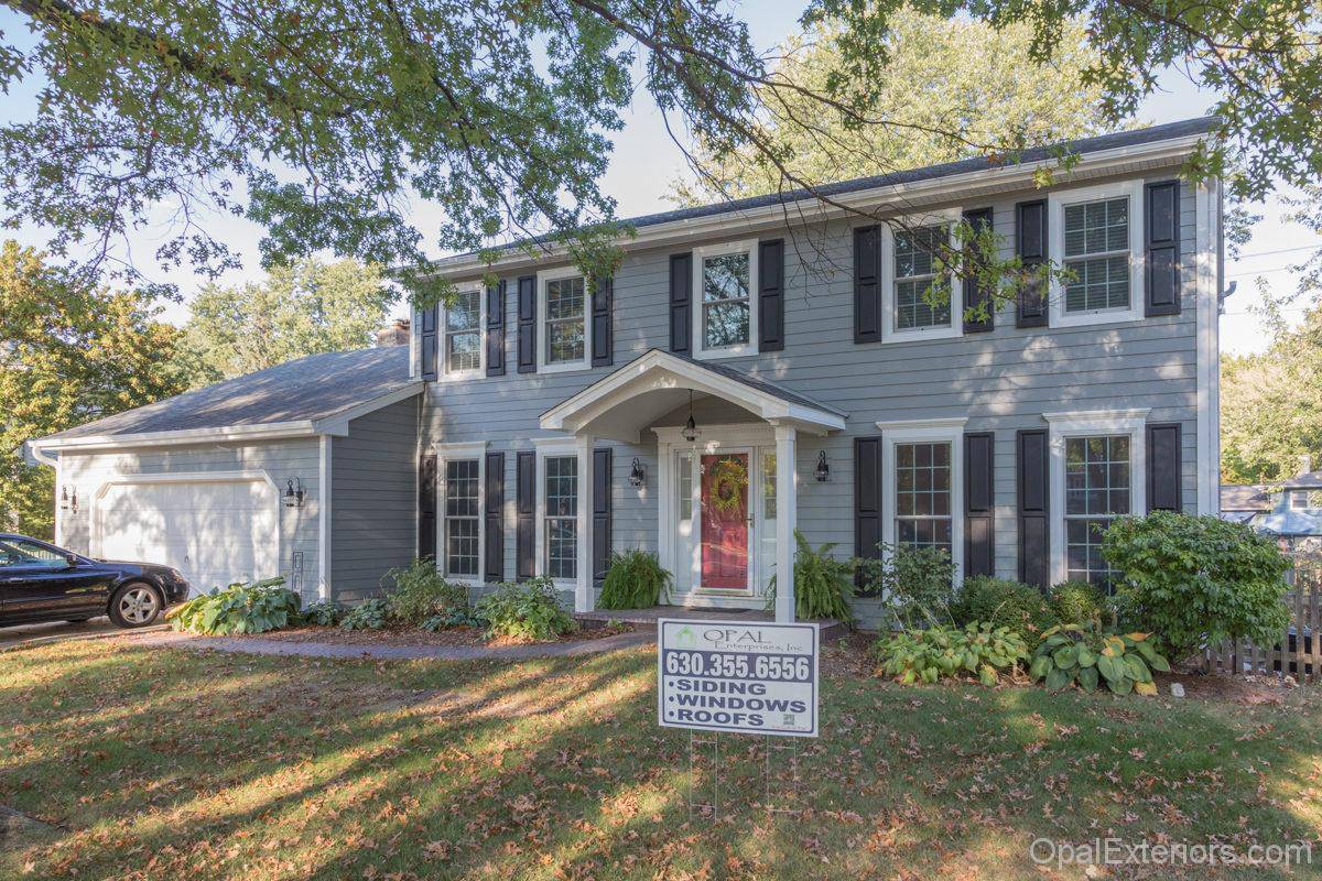 Naperville home after Opal Enterprises exterior renovation - with James Hardie Gray Slate and new Andersen Windows