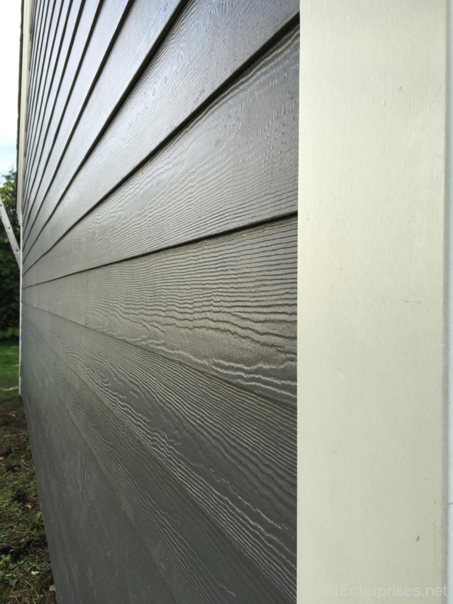 James Hardie Night Gray plank lap siding with Arctic White trim