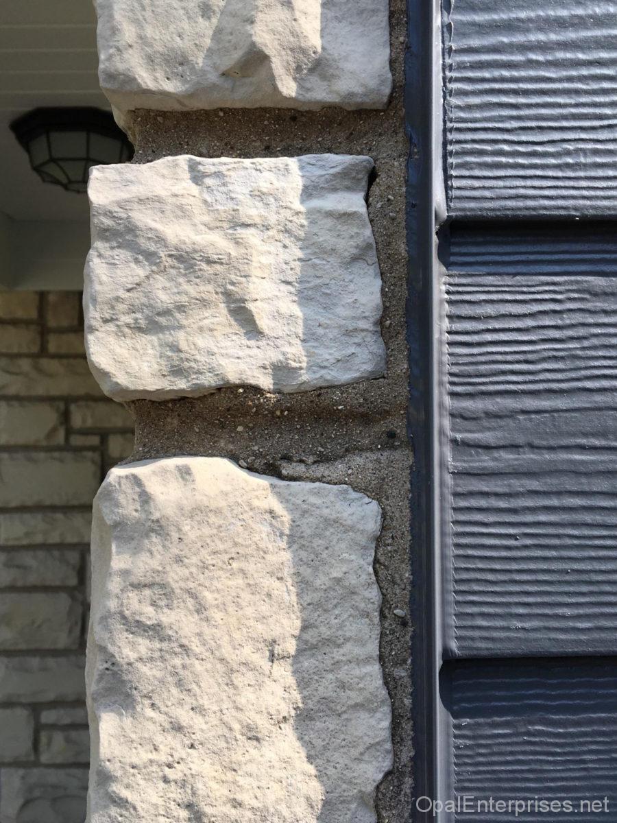 close up of seam between stone and siding