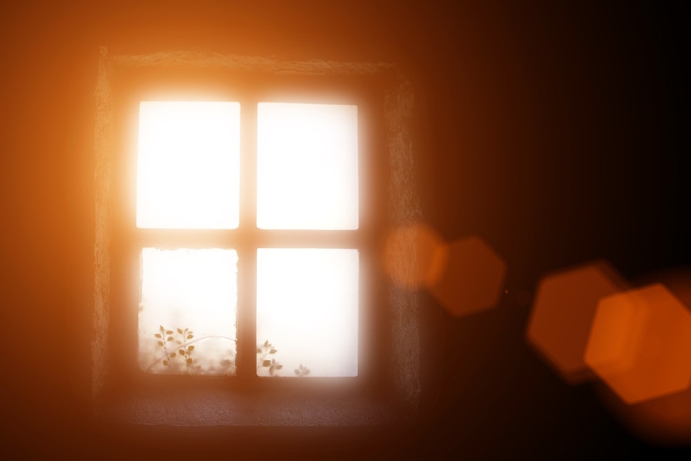 Sunlight streaming through an old window.