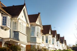 A row of houses with bow windows. You can learn more about what a bow window is today.